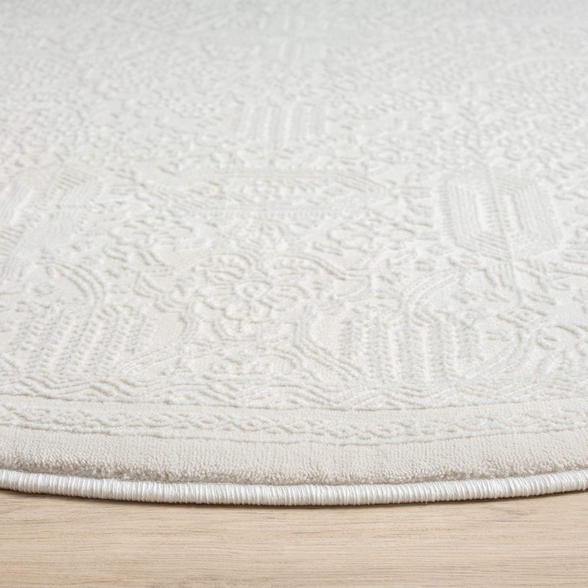Fable 471 Ivory Round-This serene collection, with its muted tones and patterns, brings harmony and luxury to your floors while being restful for the eyes. The highly decorative and beautifully textured pile is made from polyester and polypropylene, power