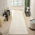 Minimalist cream runner carpet on wooden floor, showcasing a tranquil and elegant home interior setting.