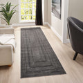 Minimalist dk grey runner displayed in a modern living room with a cozy sofa and a decorative plant.