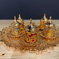 Gold Ottoman-Style Coffee Cup Set displayed on ornate tray with colorful ornate cups.