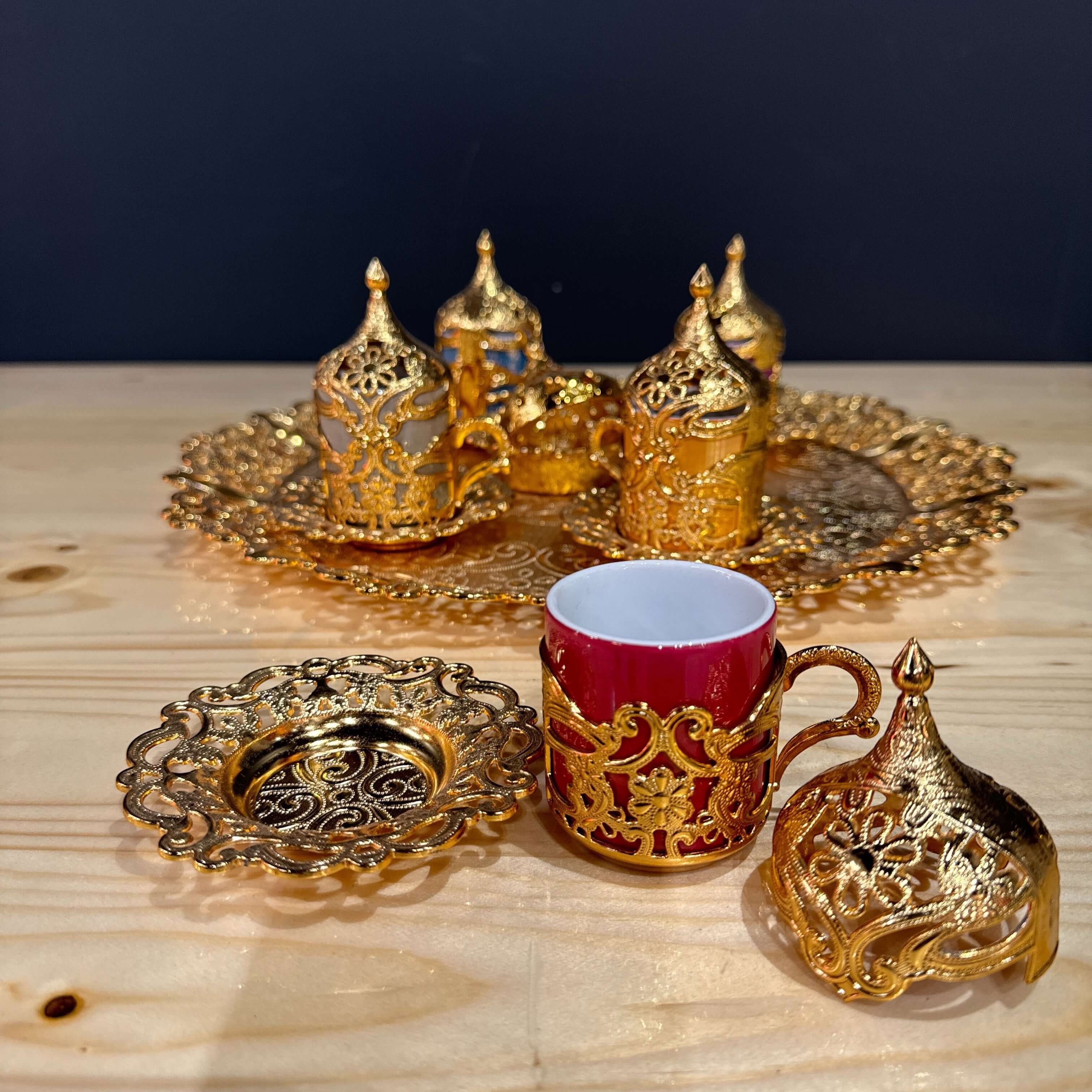 Gold Ottoman-Style Coffee Cup Set displayed with ornate gold holders and a decorative tray.