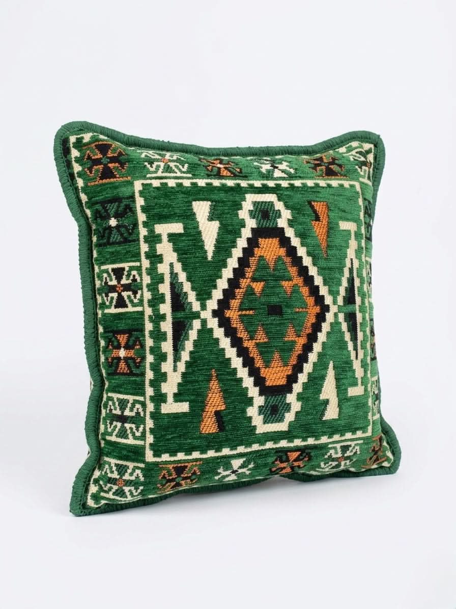 Green kilim cushion - 40x40cm Serenity featuring intricate geometric patterns in earthy tones.