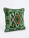 Green kilim cushion - 40x40cm Serenity featuring intricate geometric patterns in earthy tones.