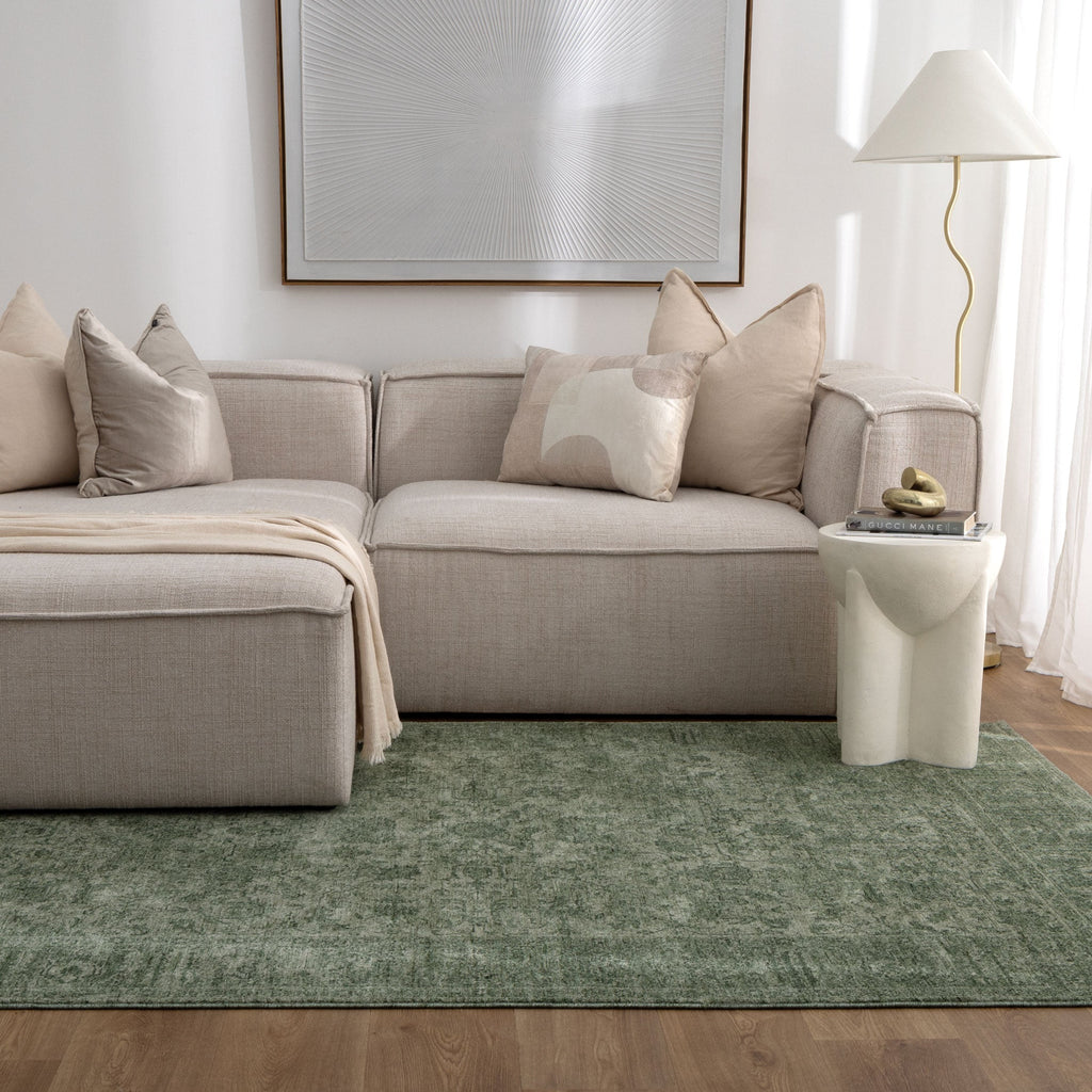 Heritage H107 Green Distressed Border Rug styled with furniture