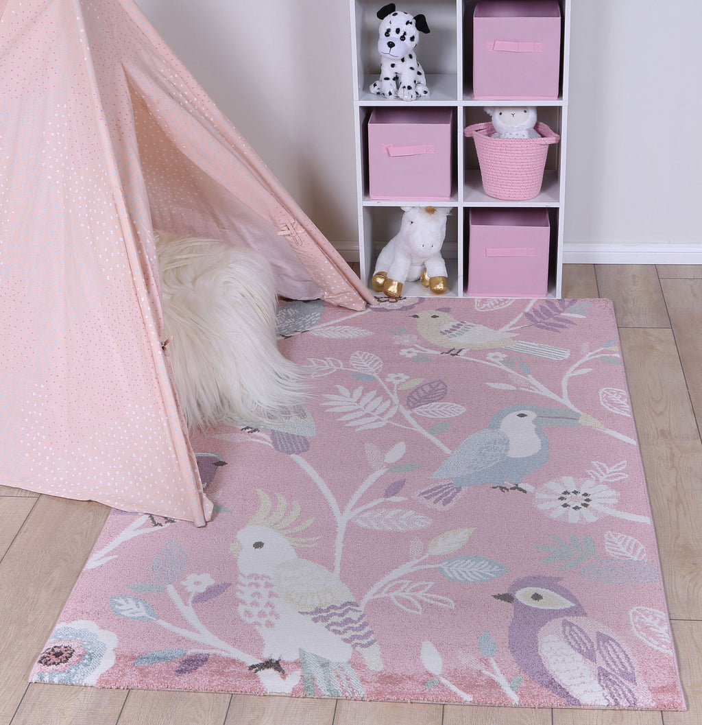 Happy Feet Bright Birds Pink Kids Rug styled with furniture