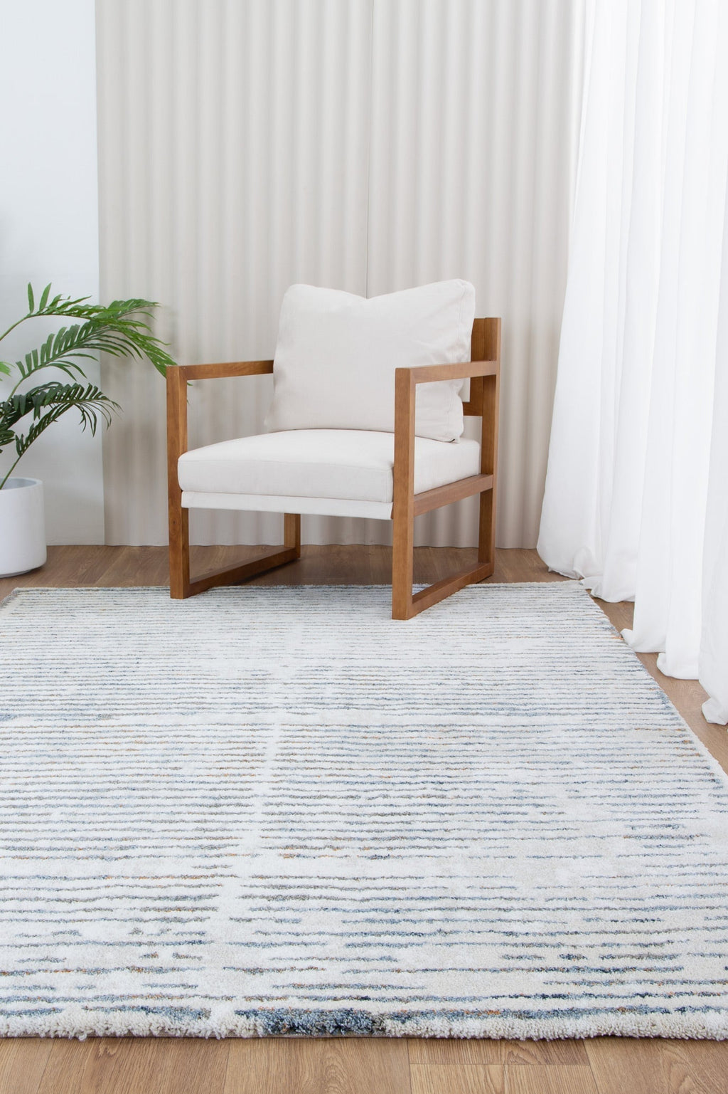 Indulgence Distressed Lines Blue Rug - INDU005 styled with furniture