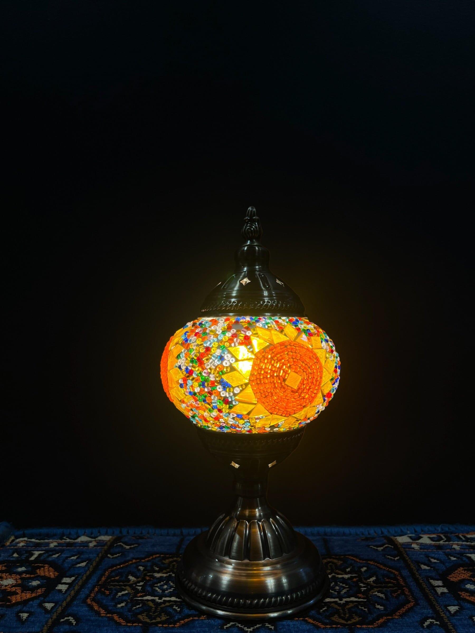 Mosaic Table Lamp with vibrant glass design featuring traditional Turkish patterns, illuminating warm colors.