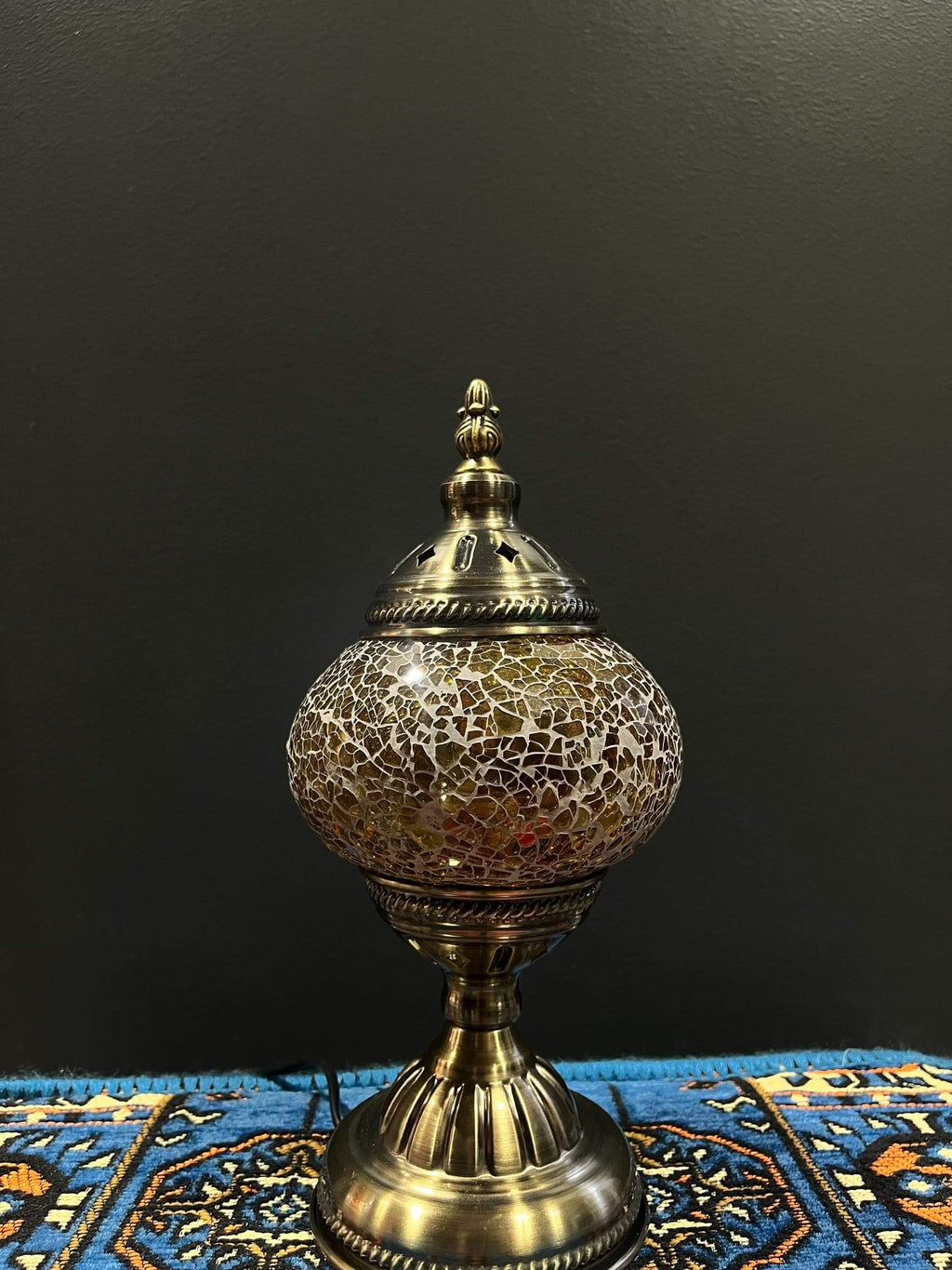 Mosaic Table Lamp Gold Crackle with vibrant glass mosaic details on a decorative table.