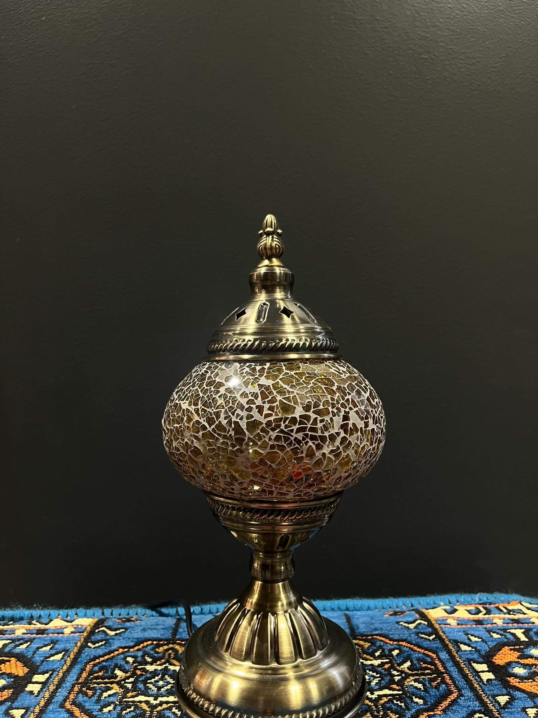 Mosaic Table Lamp Gold Crackle with vibrant glass mosaic details on a decorative table.