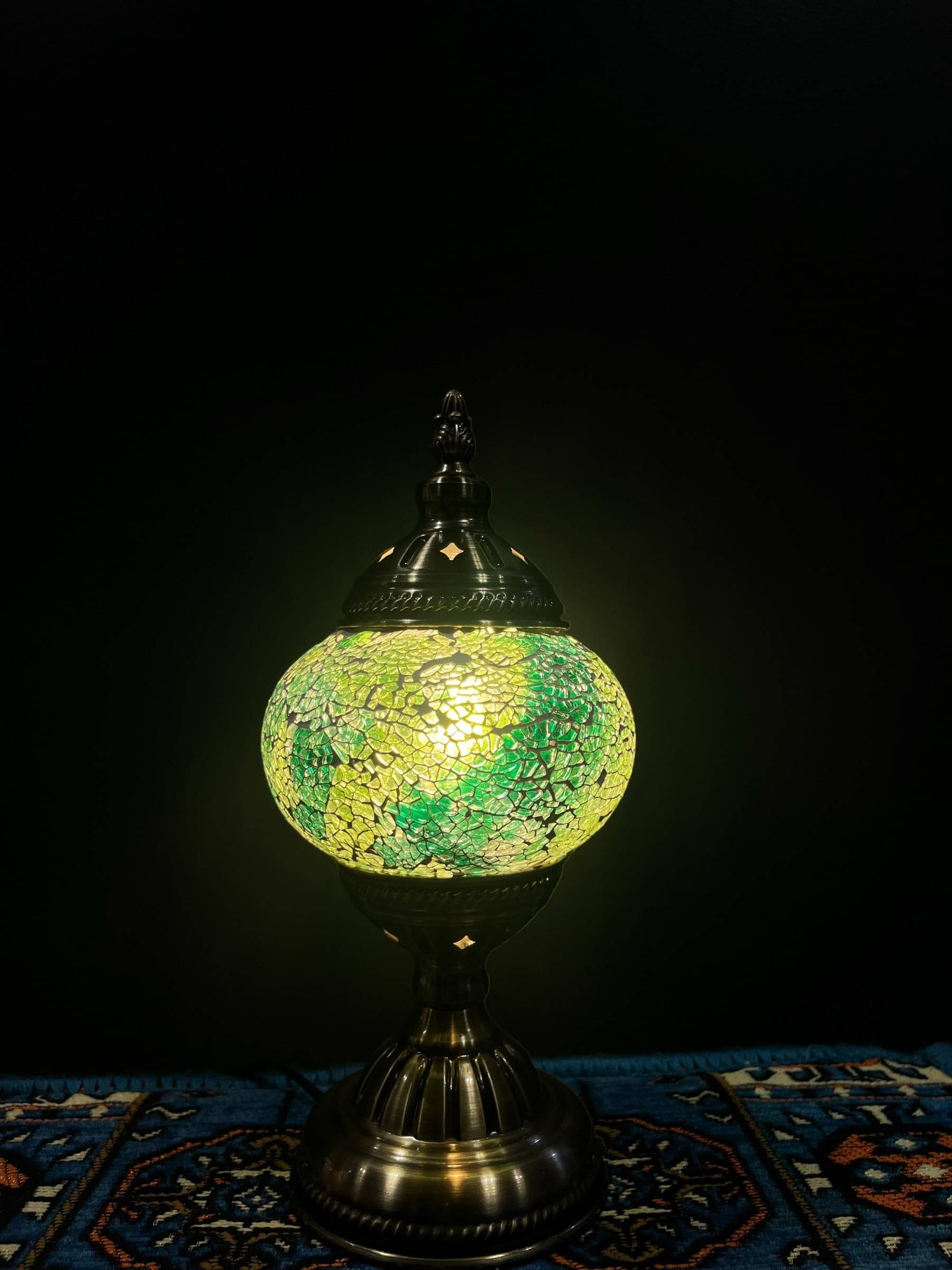 Mosaic Table Lamp Green Crackle illuminating a vibrant glass mosaic design in warm light.