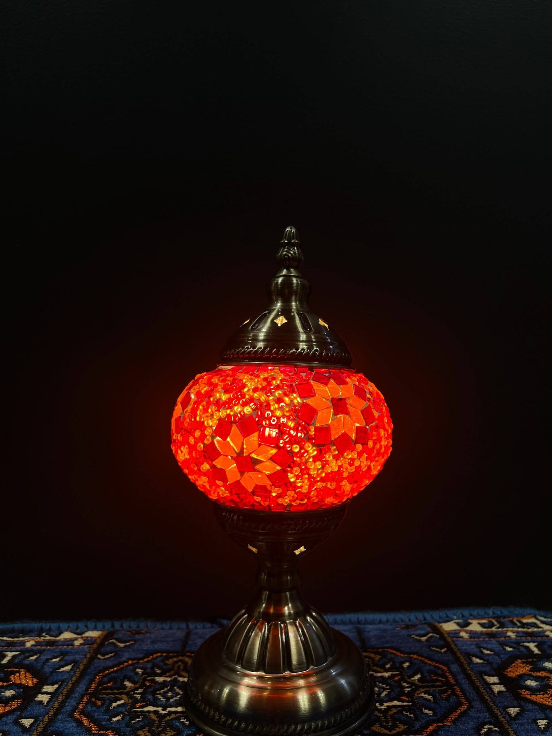 Mosaic Table Lamp with vibrant red glass design on a decorative table.
