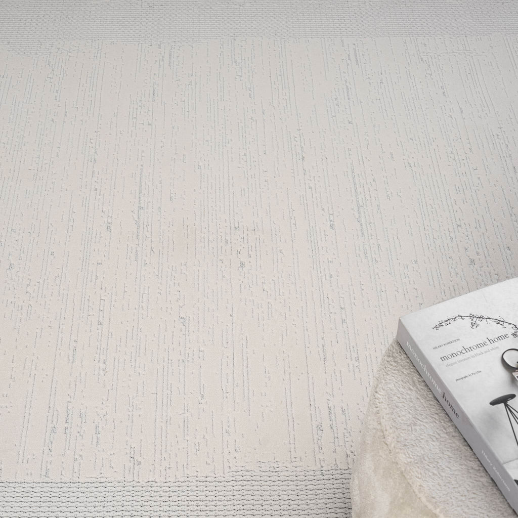 Ivory Area Rug with plush, non-shed pile and all-side binding. Power-loomed in Türkiye for durable, easy-care elegance in modern living spaces.