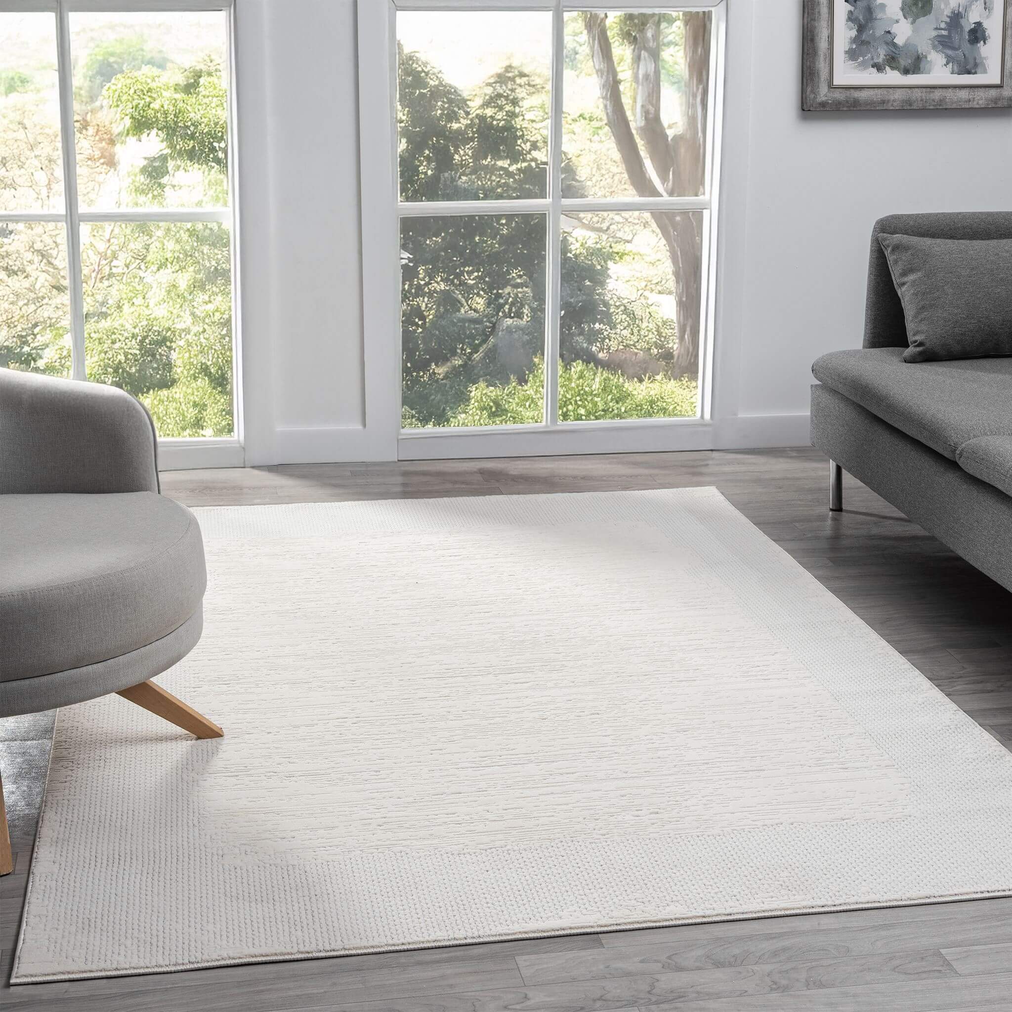 Ivory Area Rug with plush, non-shed pile and all-side binding. Power-loomed in Türkiye for durable, easy-care elegance in modern living spaces.