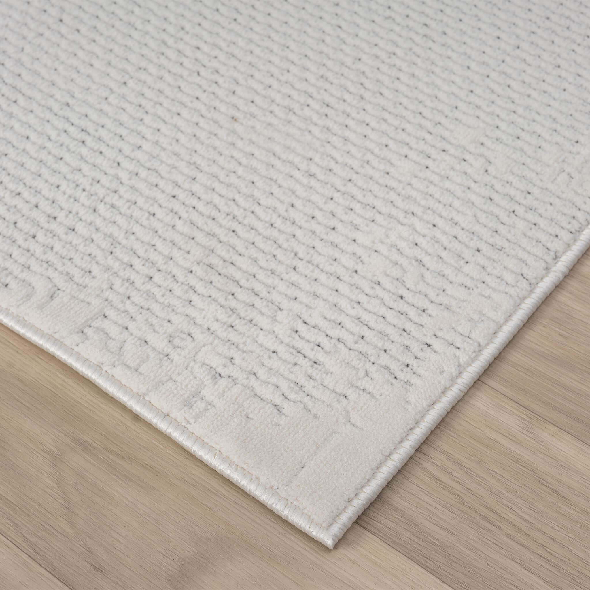 Ivory Area Rug with plush, non-shed pile and all-side binding. Power-loomed in Türkiye for durable, easy-care elegance in modern living spaces.