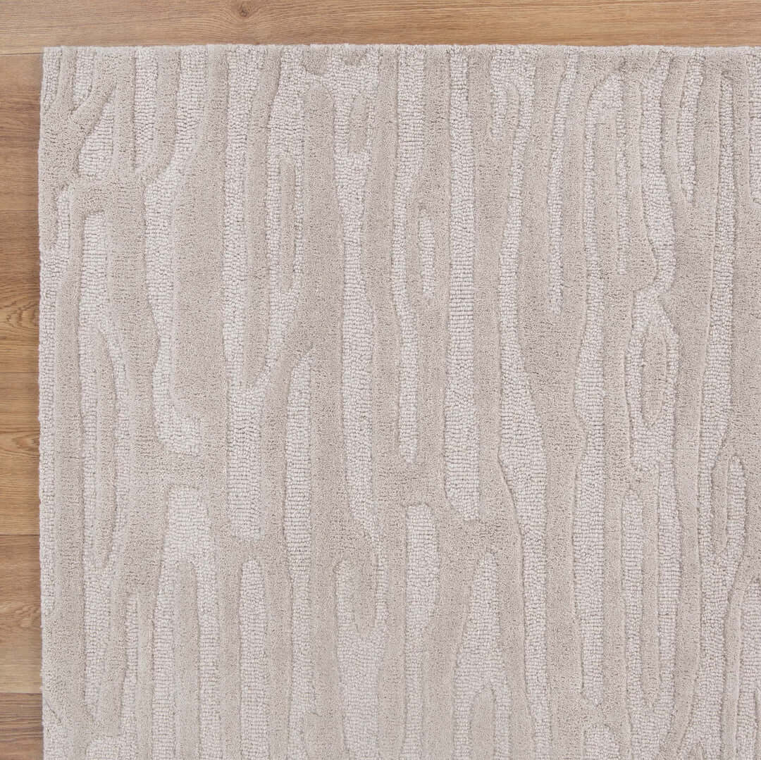 Les Nomades Sandstorm Beige wool rug - styled view