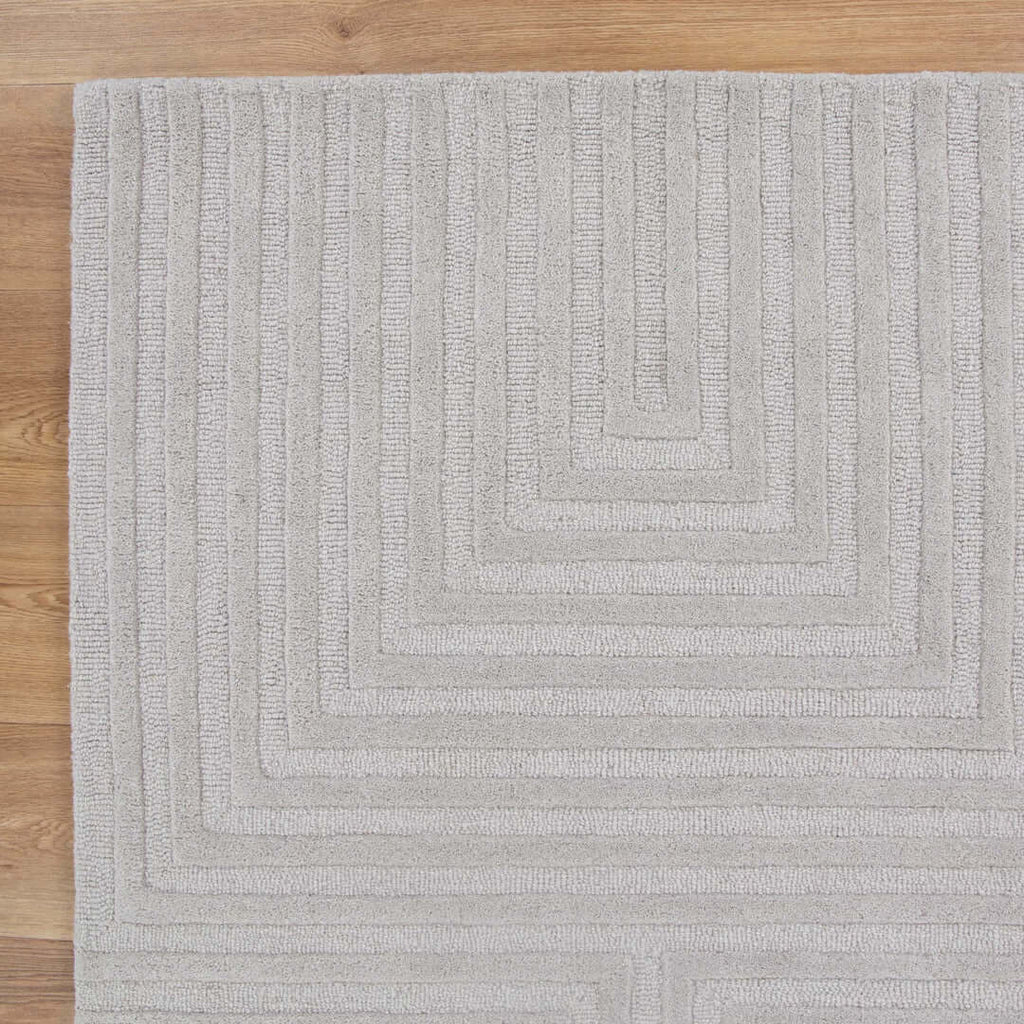 Les Nomades Felix Light Grey wool rug - styled view