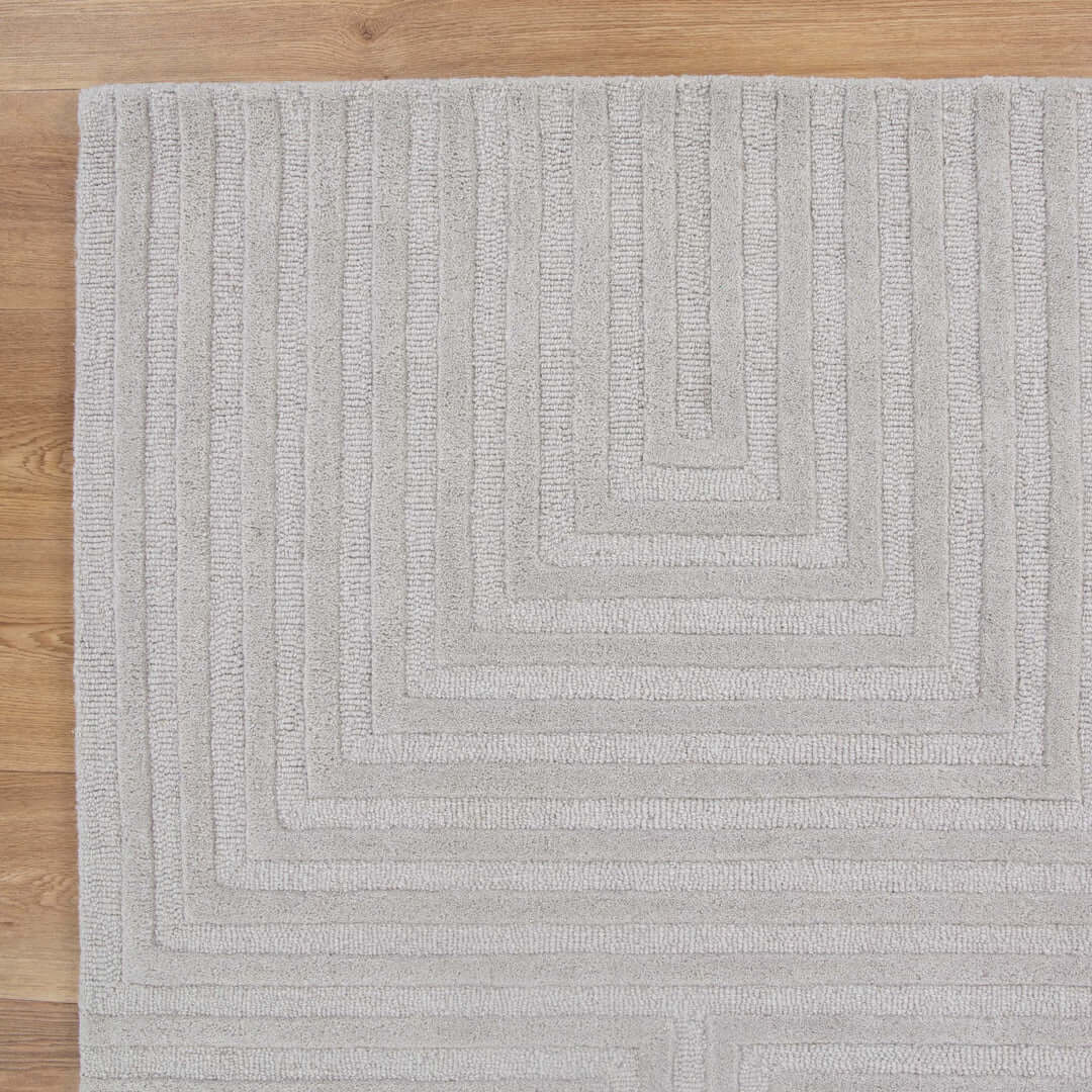 Les Nomades Felix Light Grey wool rug - styled view