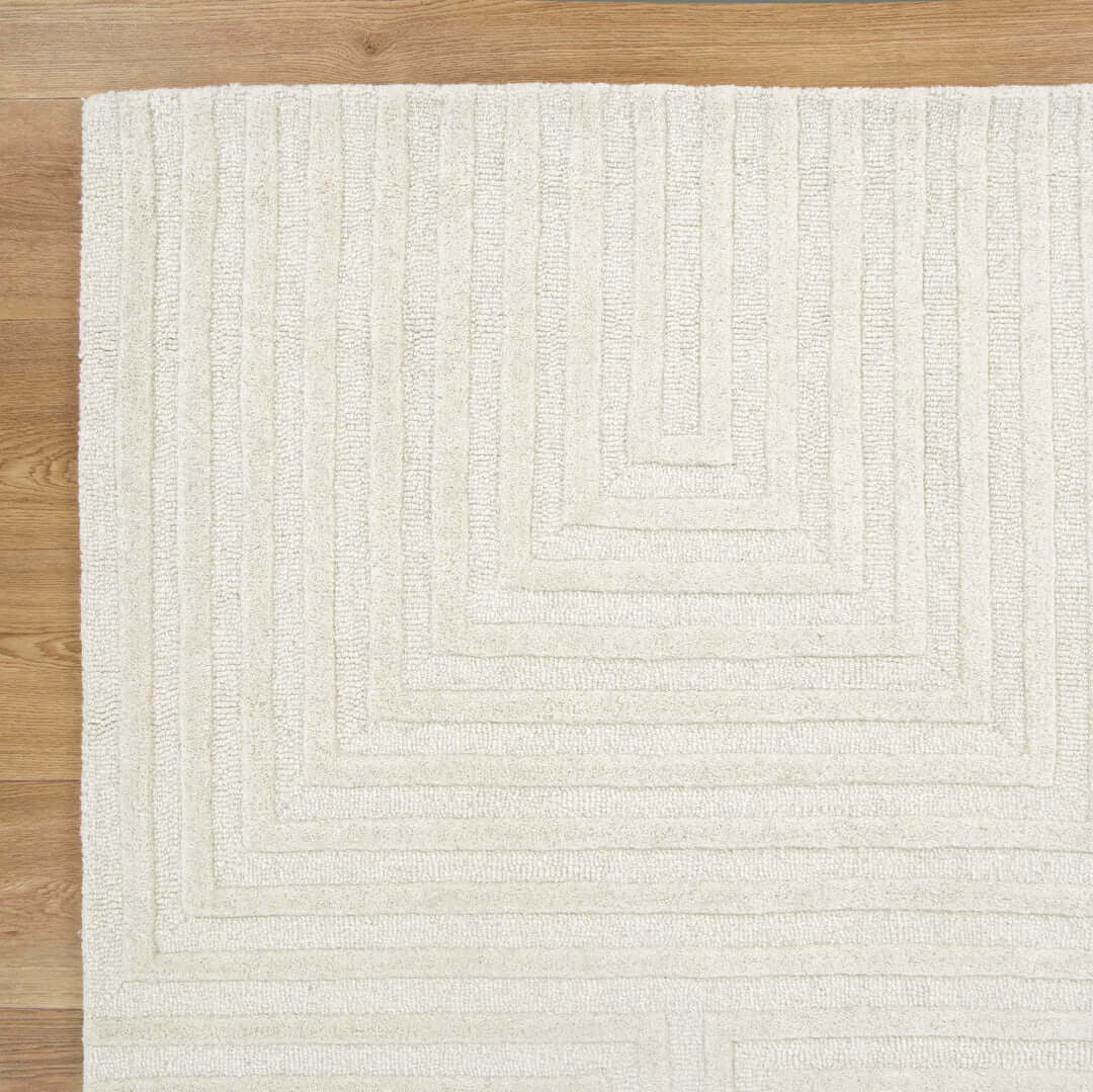 Les Nomades Felix Cream wool rug - styled view