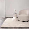 Les Nomades Felix Cream wool rug - room setting