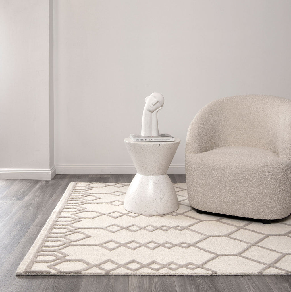 Les Nomades Senso Beige Wool Rug styled with furniture