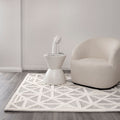 Les Nomades Trilogy Greige Wool Rug styled with furniture