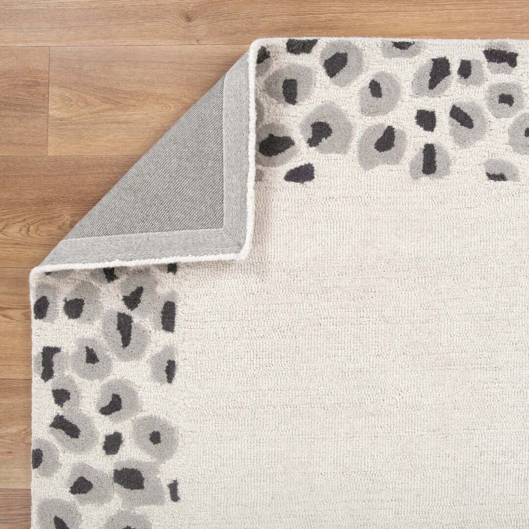 Les Nomades Leopard Cream Grey Wool Rug room view