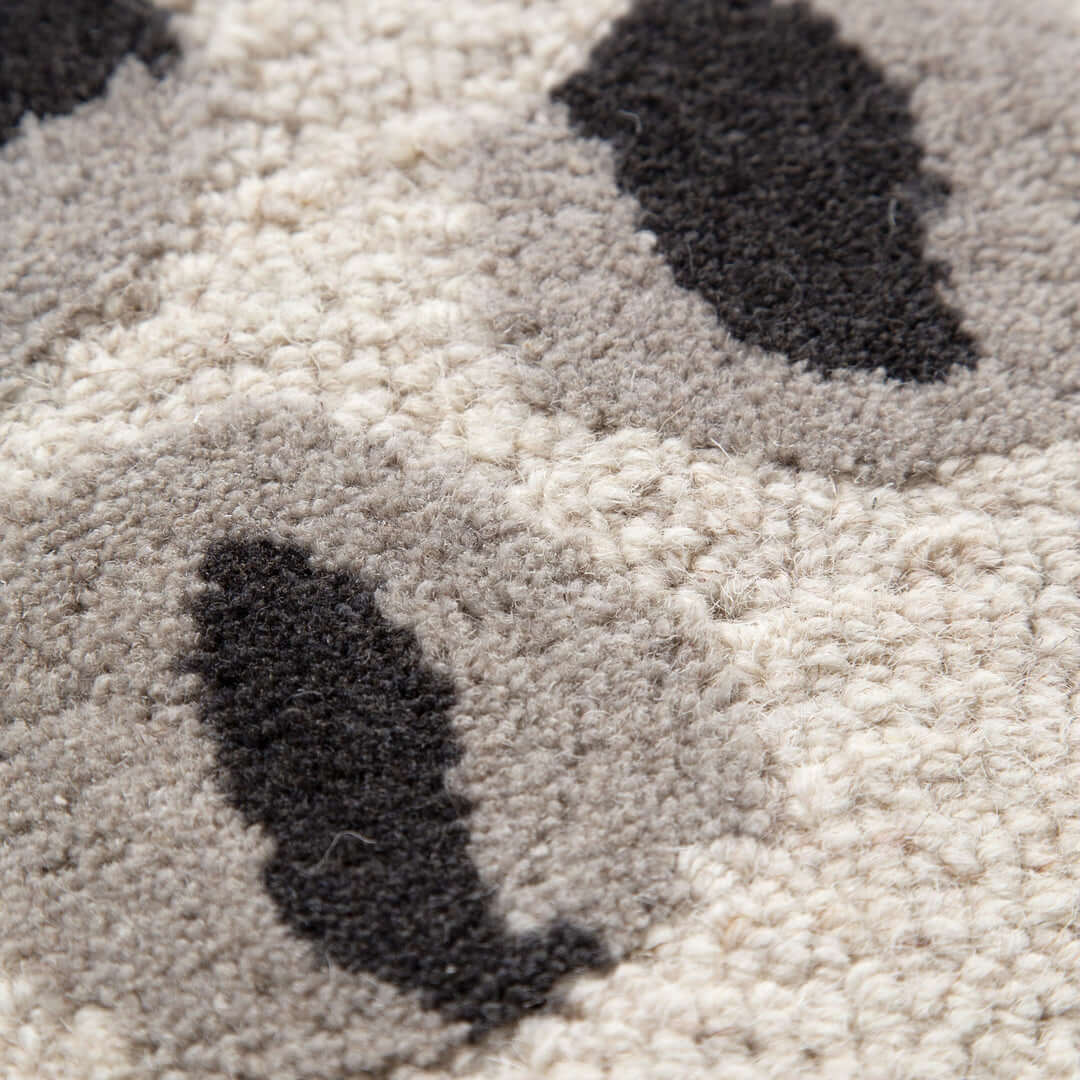 Les Nomades Leopard Cream Grey Wool Rug close-up