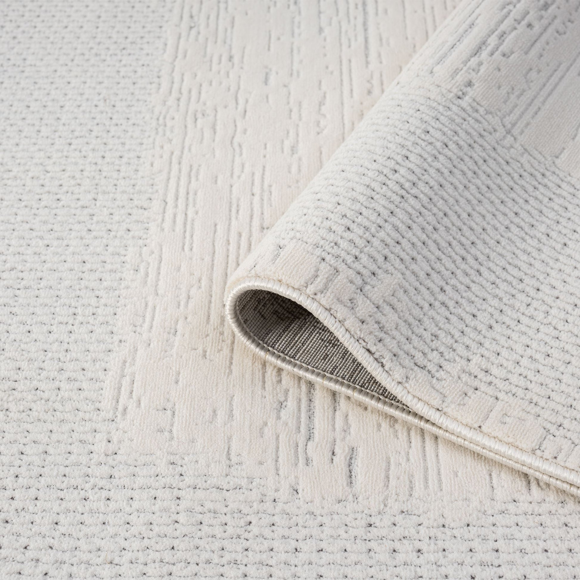 Ivory Area Rug with plush, non-shed pile and all-side binding. Power-loomed in Türkiye for durable, easy-care elegance in modern living spaces.