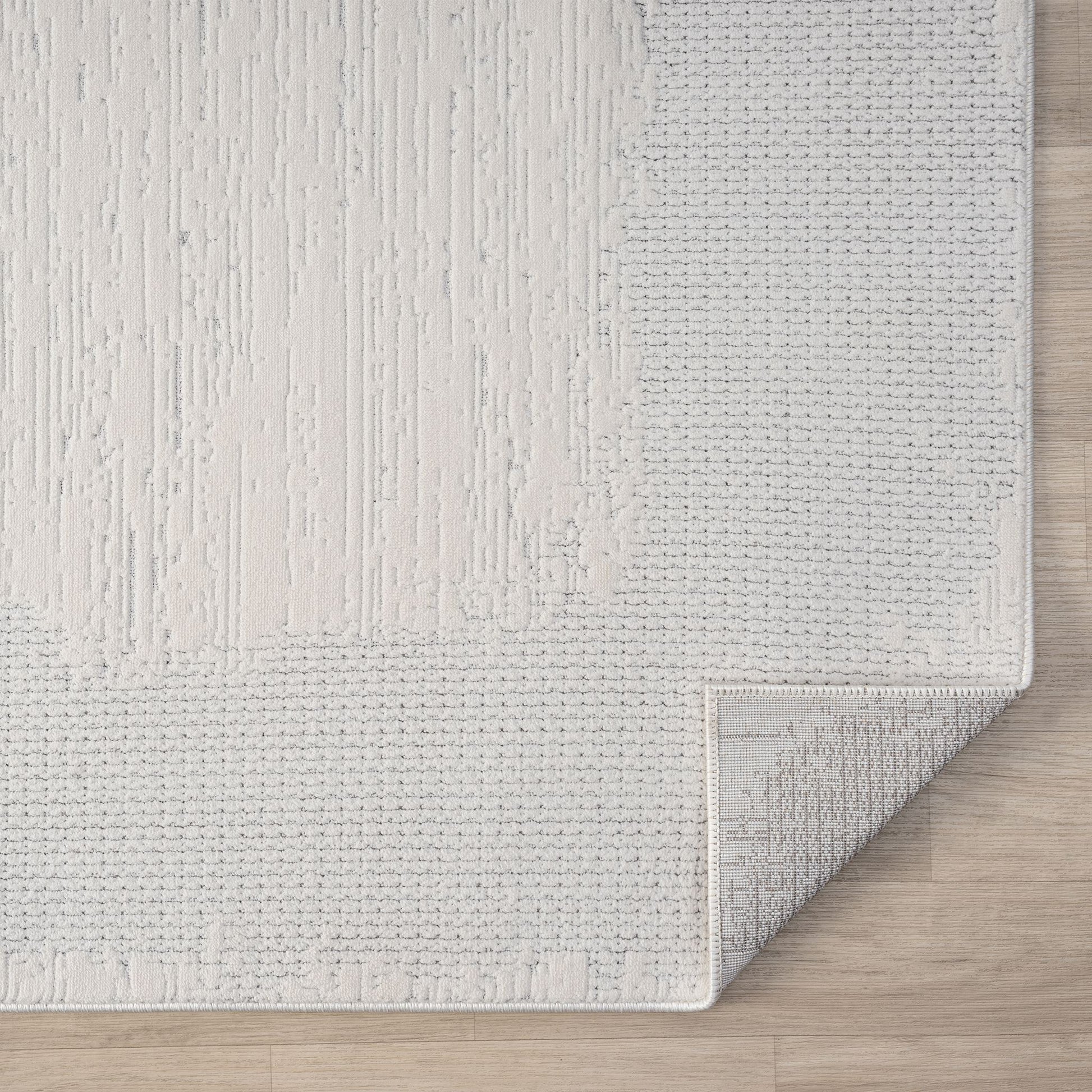 Ivory Area Rug with plush, non-shed pile and all-side binding. Power-loomed in Türkiye for durable, easy-care elegance in modern living spaces.