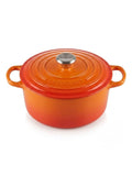 Le Creuset round casserole pot 24cm in vibrant gradient orange with lid.