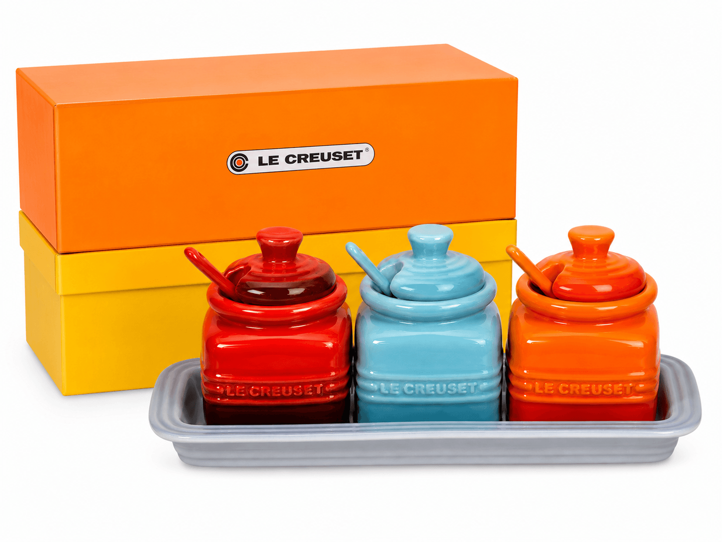 Le Creuset Ceramic Condiment Pot Set with Tray featuring colorful pots and ceramic spoons, perfect for kitchen organization.