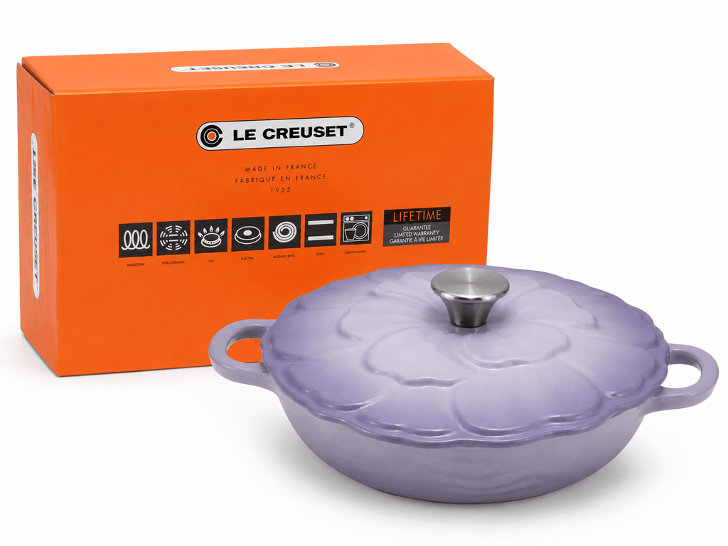 Le Creuset Flower Cast Iron Casserole Dish 26cm in Lavender Purple with box, showcasing elegant cookware.