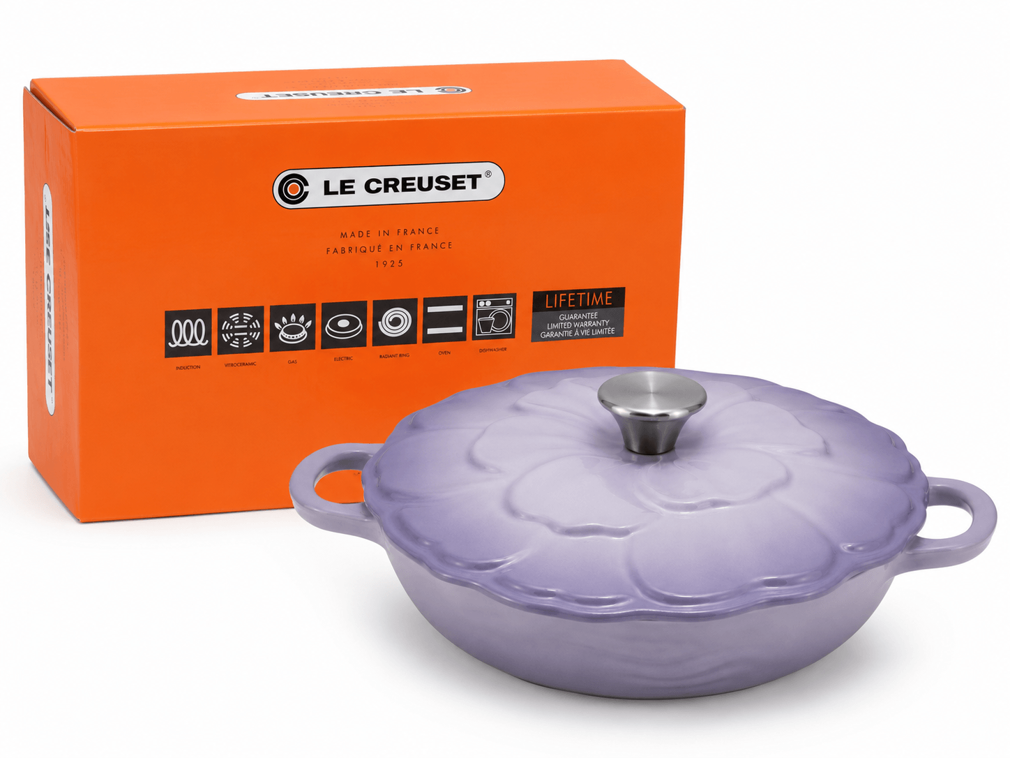 Le Creuset Flower Cast Iron Casserole Dish 26cm in Lavender Purple with box, showcasing elegant cookware.
