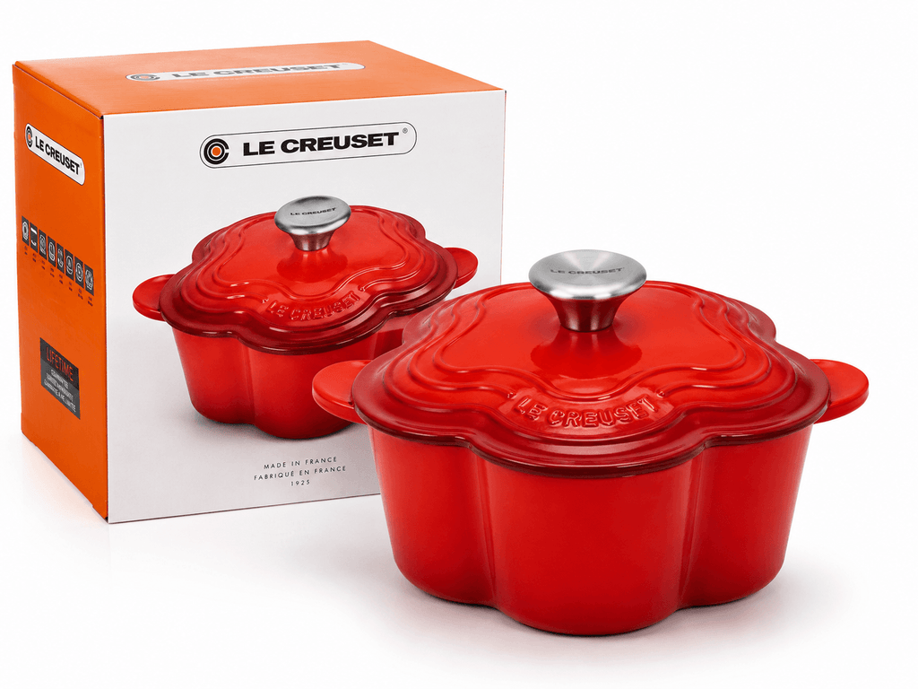 Le Creuset Flower Cocotte 20cm red in a stylish red color with packaging displayed.
