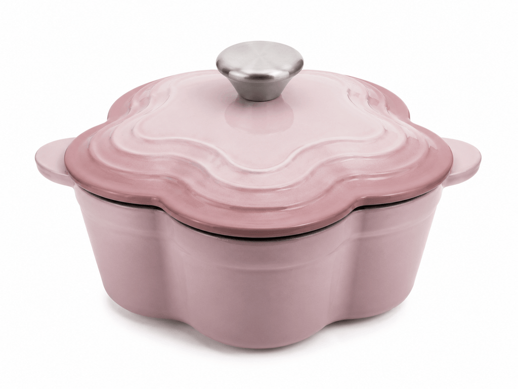 Le Creuset flower shaped cast iron cocotte 20cm 2L in Chiffon Pink with silver knob on top.