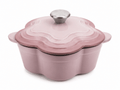 Le Creuset flower shaped cast iron cocotte 20cm 2L in Chiffon Pink with silver knob on top.
