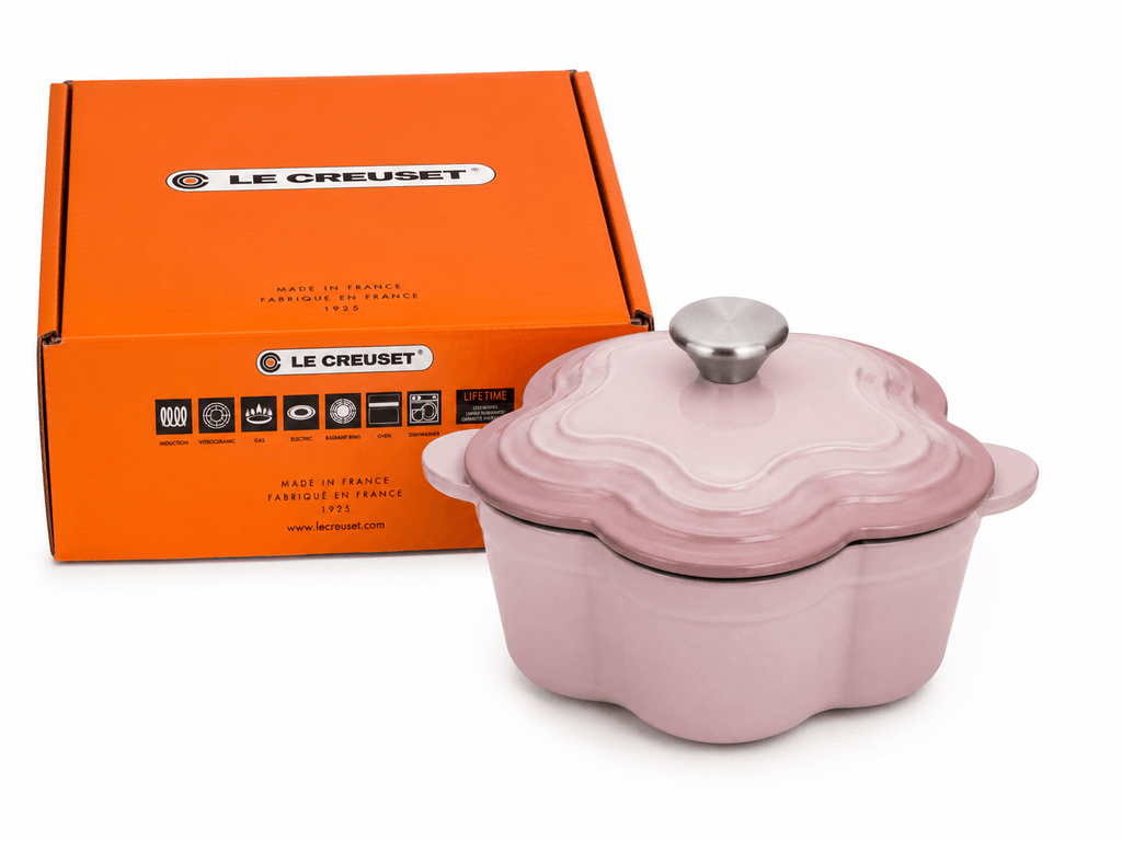 Le Creuset Flower Shaped Cast Iron Cocotte 20cm 2L in Chiffon Pink with branded packaging.