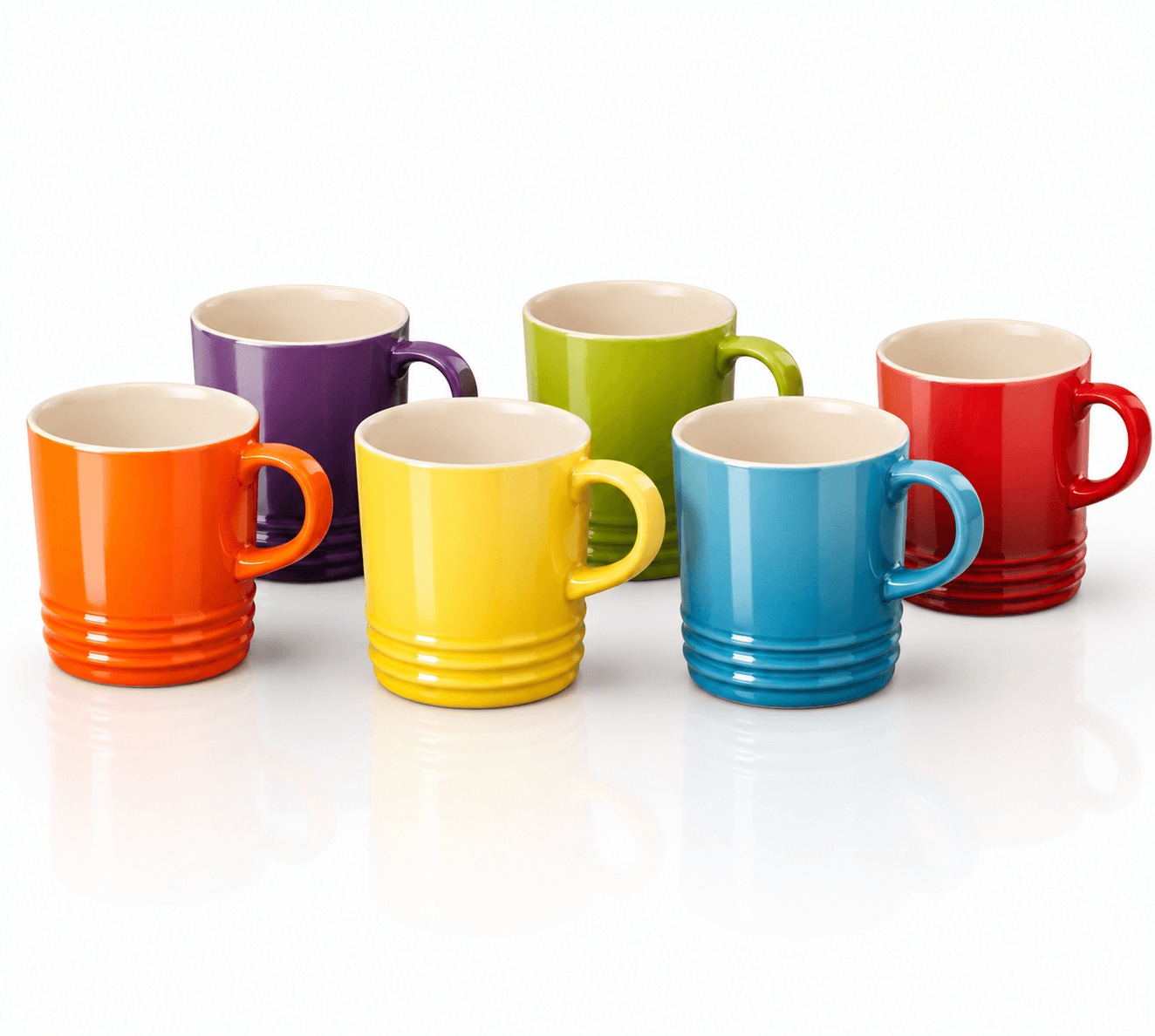 Le Creuset rainbow ceramic mug set featuring six vibrant ceramic coffee mugs in assorted colors.