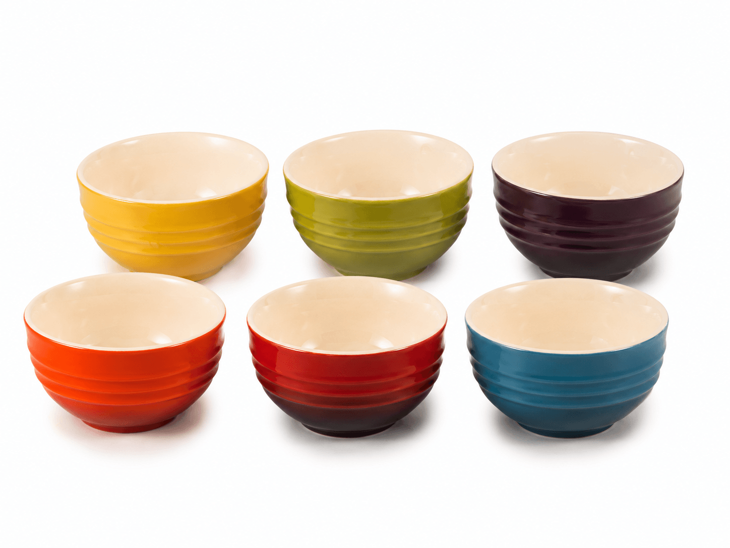 Le Creuset mini stoneware bowls set in vibrant colors for serving snacks and desserts.