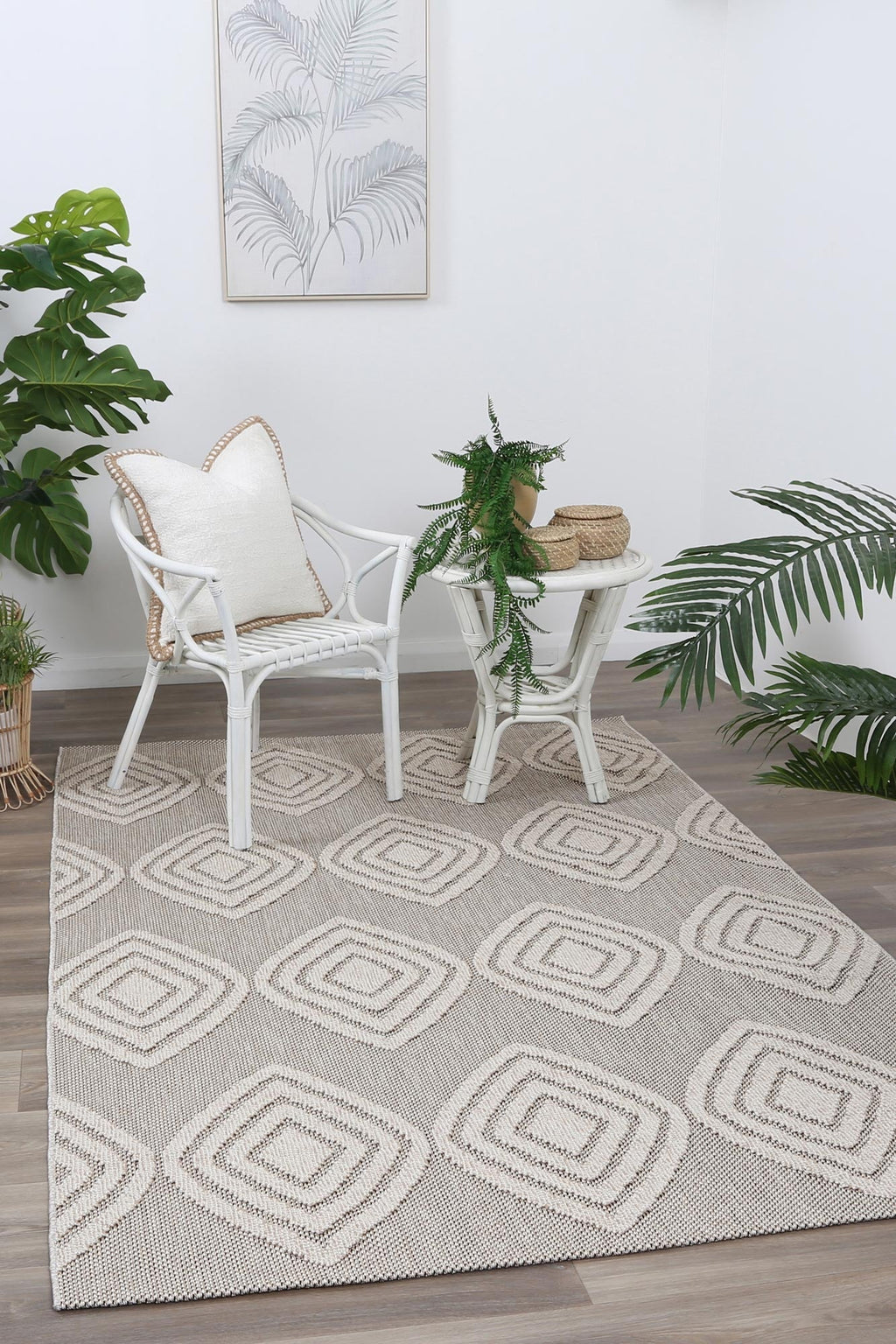 Maldives Modern Indoor/Outdoor Brown Rug styled with furniture
