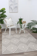Maldives Modern Indoor/Outdoor Brown Rug styled with furniture