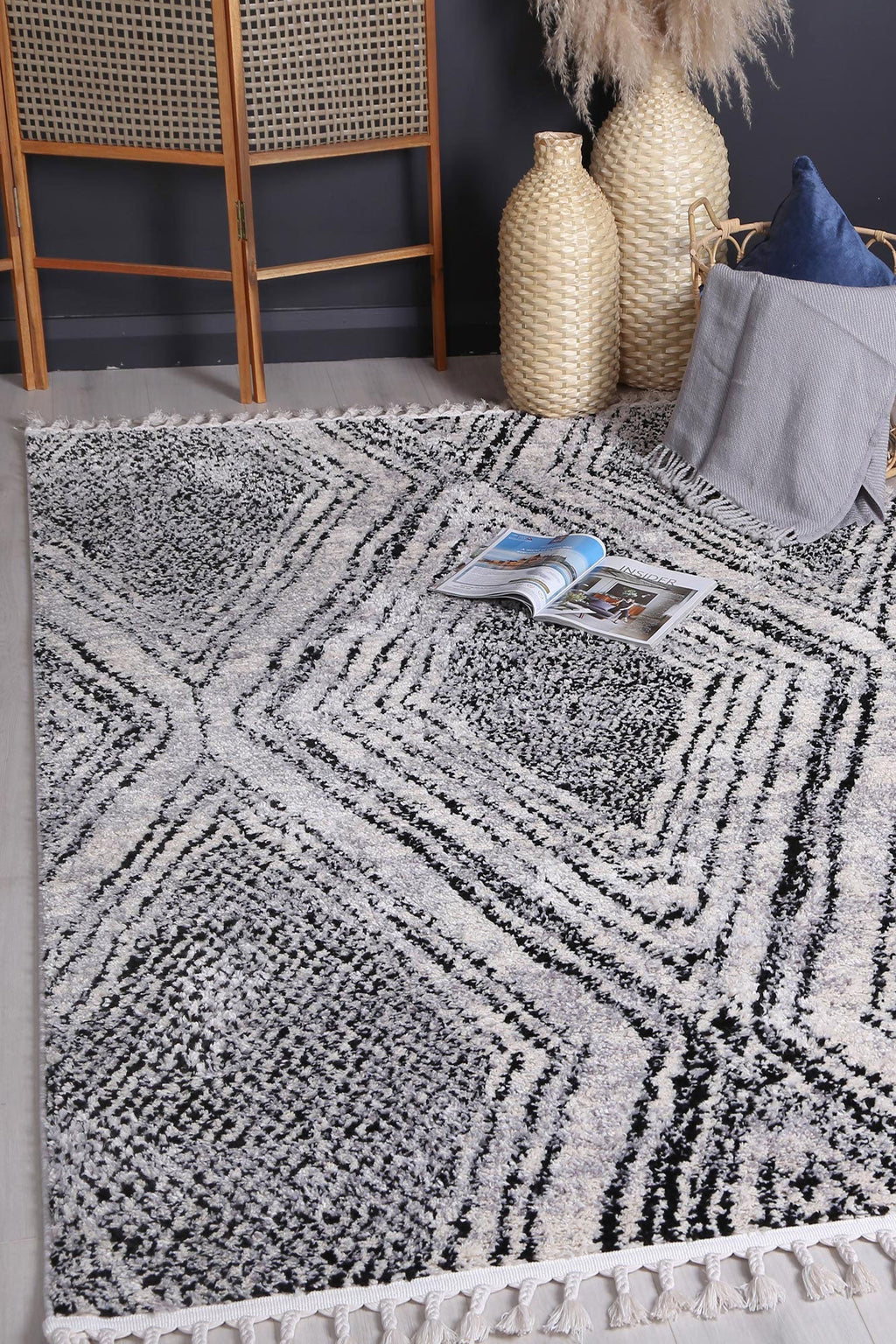 Mansour Harlequin Black & White Geometric Rug - 6BWHI styled with furniture
