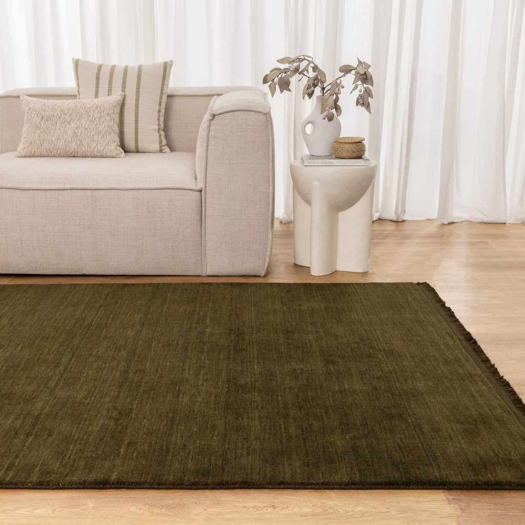 Charleston Green Hand Knotted Wool Blend Rug styled with furniture