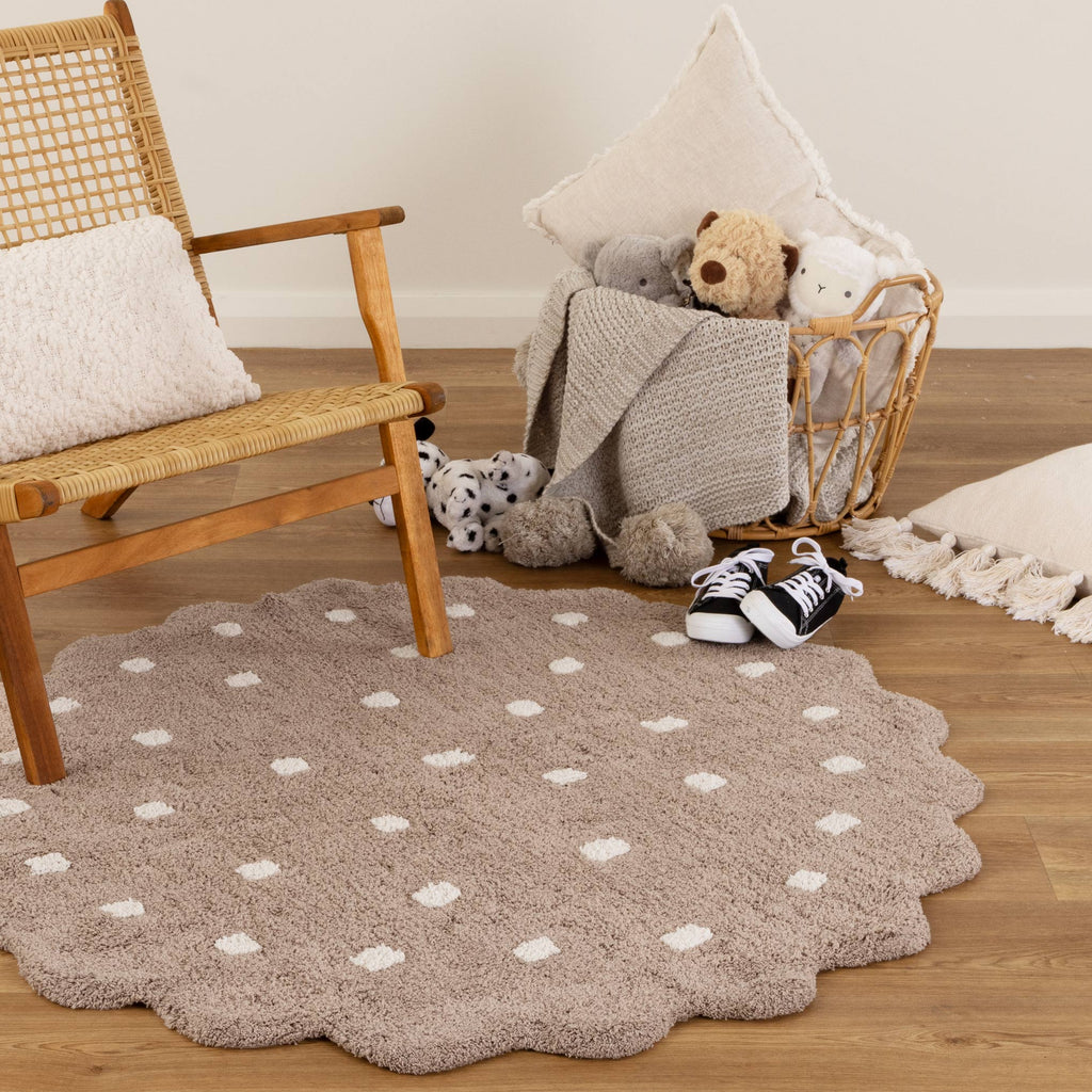 Mellow Mushroom Beige Round Scalloped Kids Rug styled with furniture