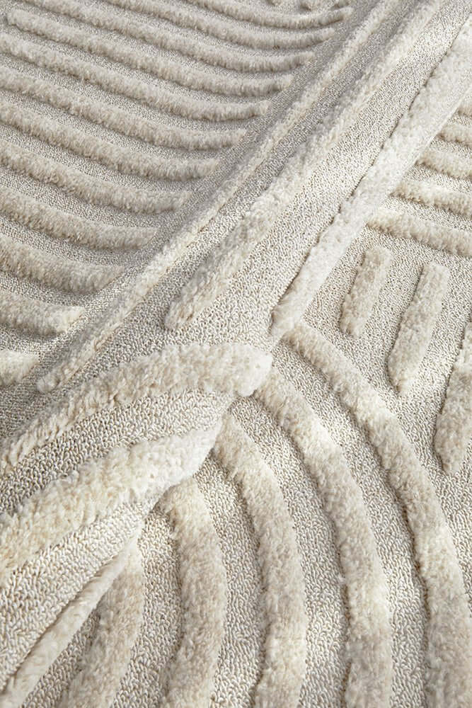 Close-up of the Marigold Dior Natural Modern Textured Rug featuring plush high-low texture, part of a modern textured area rug collection.