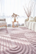 modern pink textured rug in a bright living room, featuring geometric patterns and plush texture for comfort.