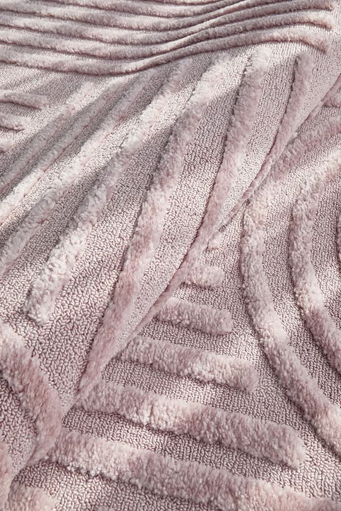 Close-up of the Marigold Dior pink modern textured rug showcasing its soft, plush, and geometric design.