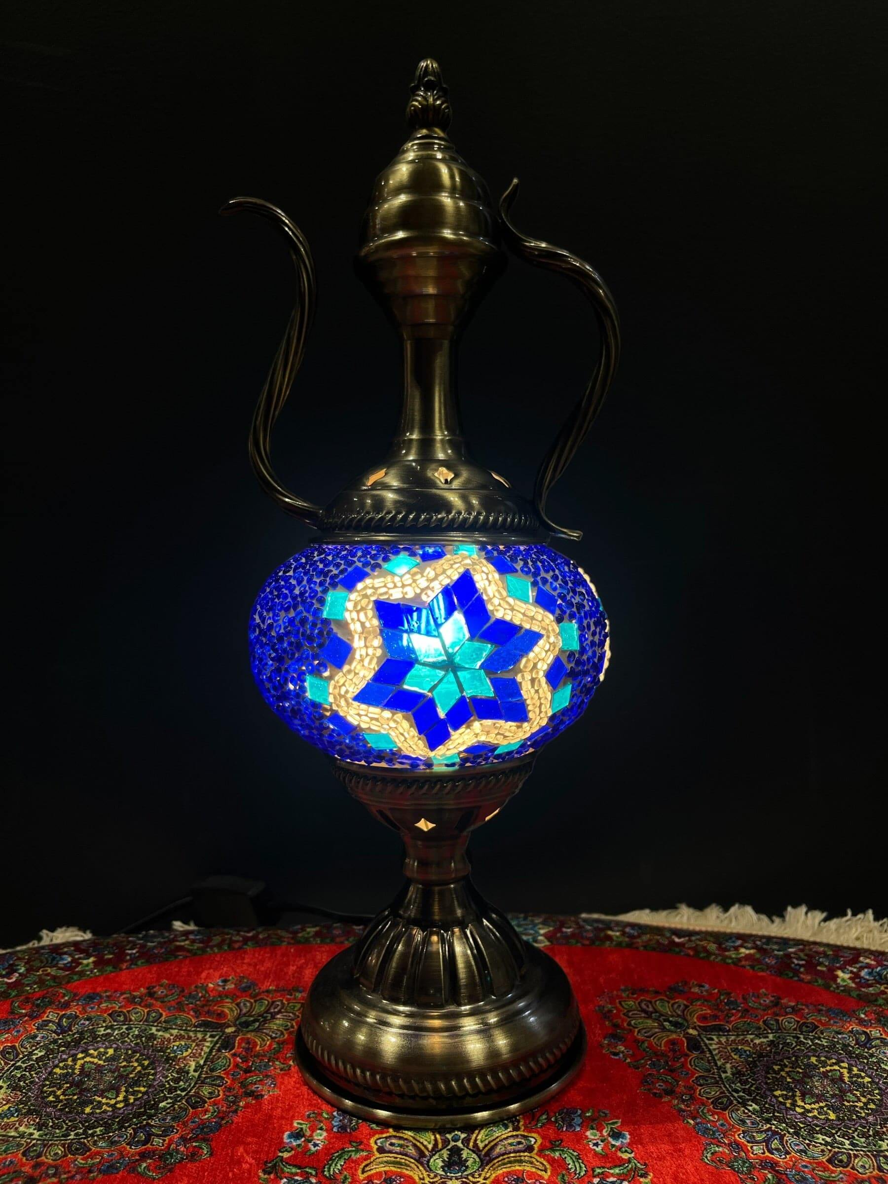 Mosaic Genie Lamp Blue Star-Elevate your decor with the enchanting charm of our Turkish Mosaic Genie Lamp. Handcrafted by skilled artisans, this exquisite lamp captures the spirit of the mystical East. Its intricate mosaic glass design creates a mesmerizi
