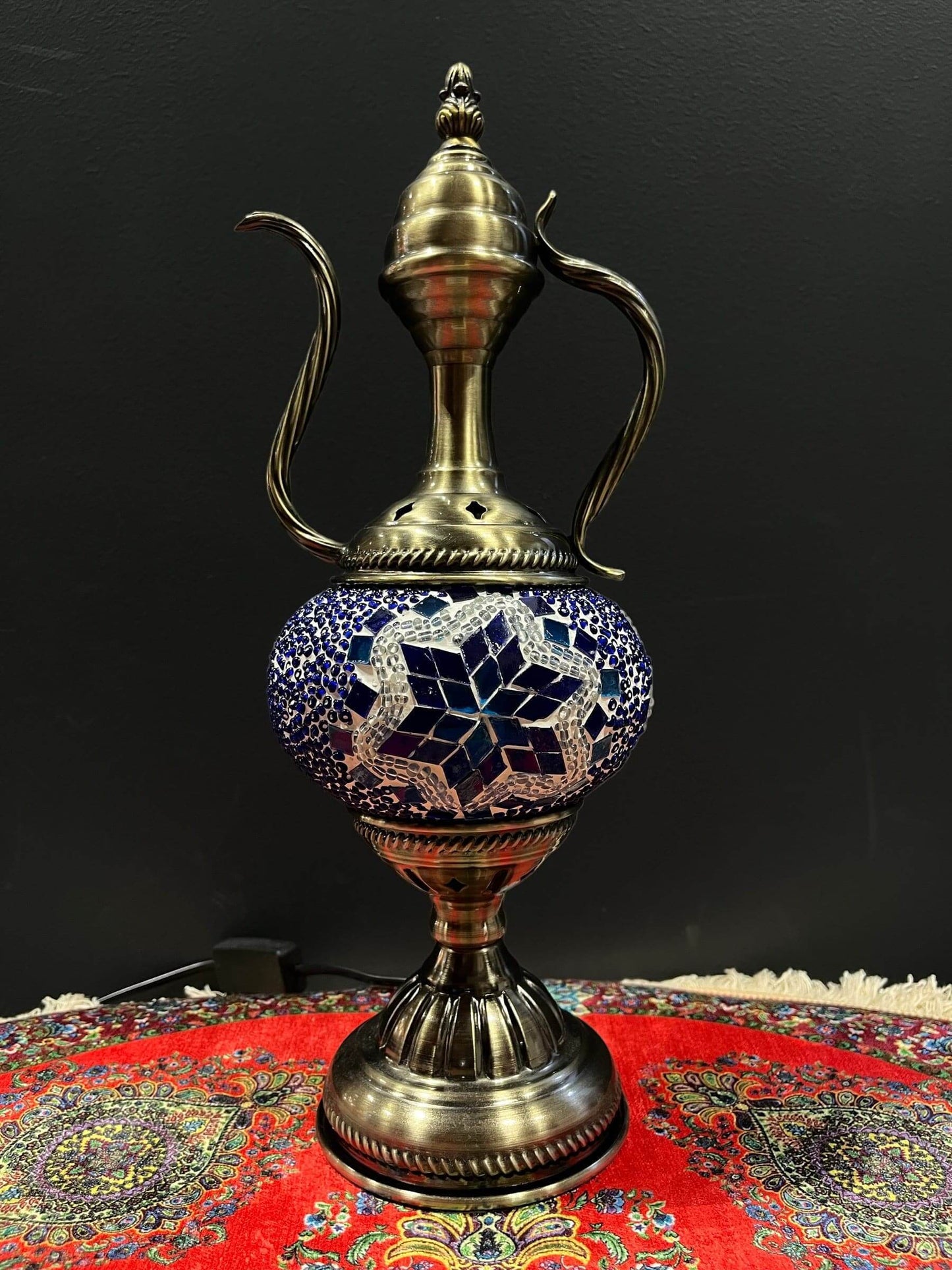 Mosaic Genie Lamp Blue Star-Elevate your decor with the enchanting charm of our Turkish Mosaic Genie Lamp. Handcrafted by skilled artisans, this exquisite lamp captures the spirit of the mystical East. Its intricate mosaic glass design creates a mesmerizi