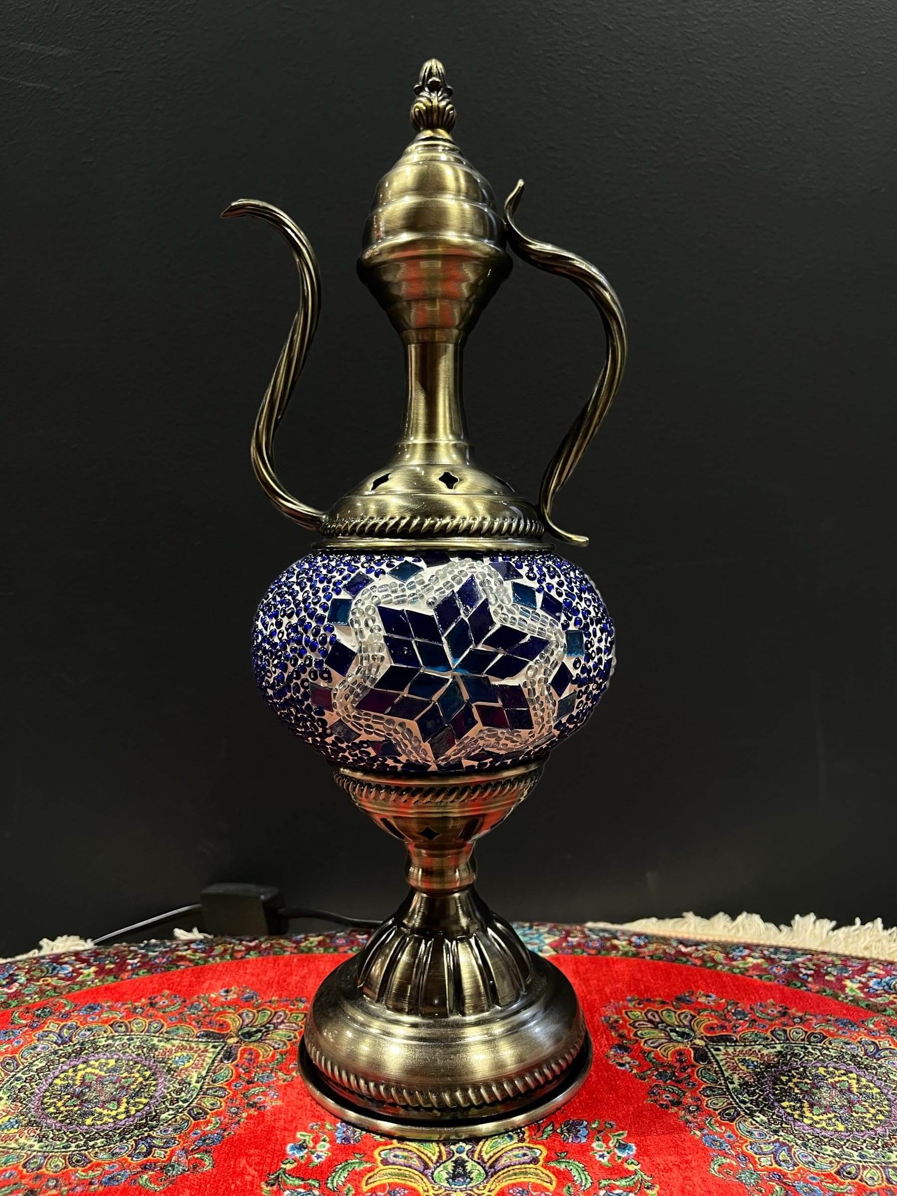 Mosaic Genie Lamp Blue Star-Elevate your decor with the enchanting charm of our Turkish Mosaic Genie Lamp. Handcrafted by skilled artisans, this exquisite lamp captures the spirit of the mystical East. Its intricate mosaic glass design creates a mesmerizi